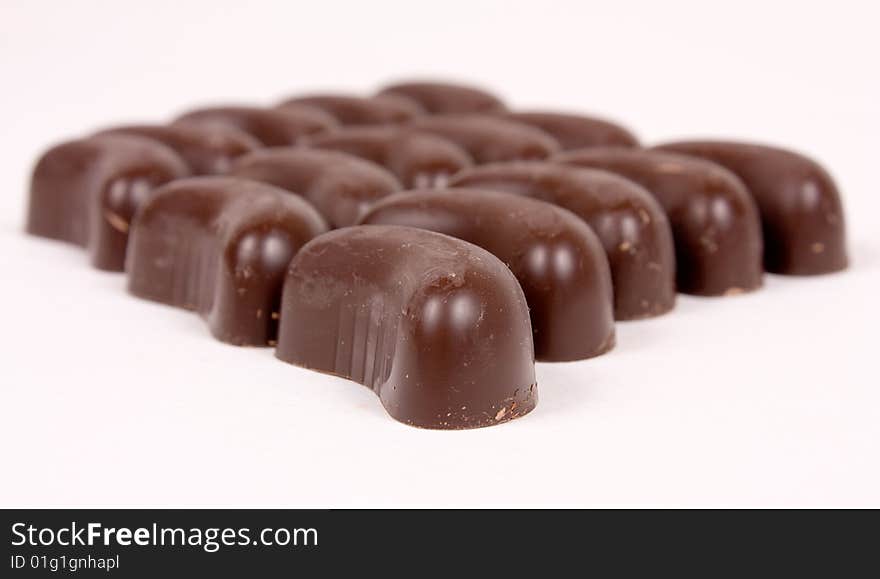 Group of chocolate candies on white background