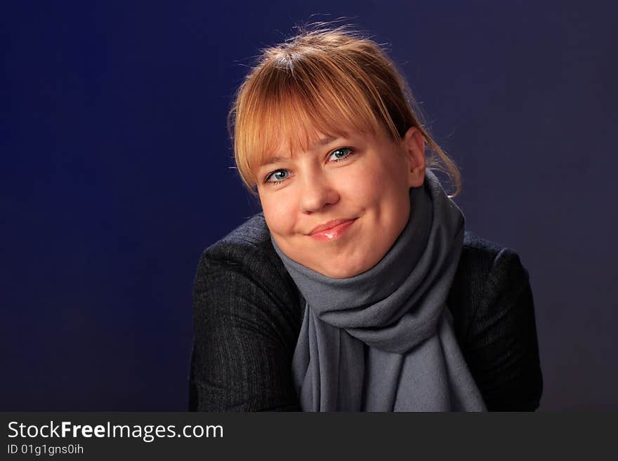 Portrait of female on a blue background in studio