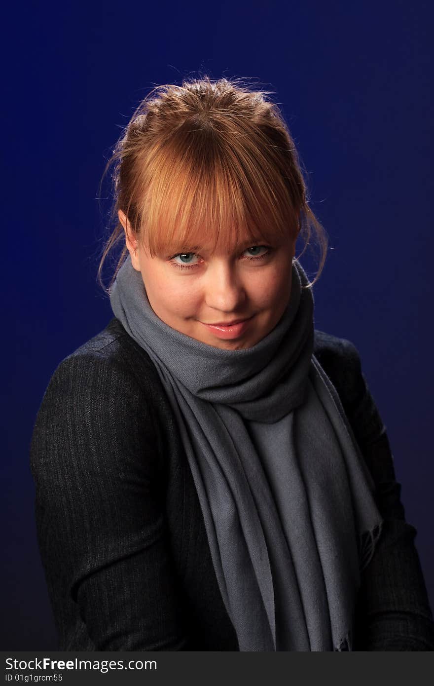 Portrait of female on a blue background in studio