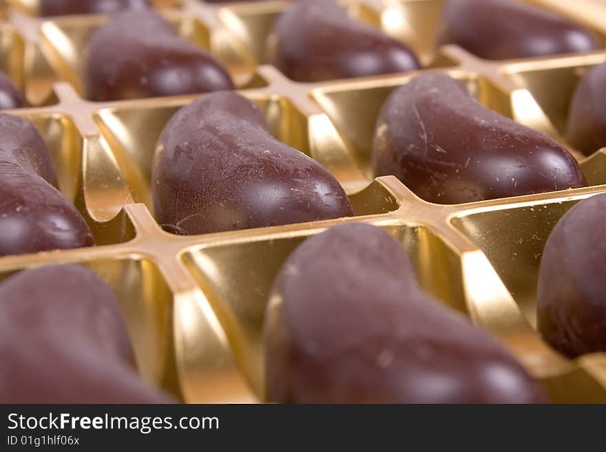 Rows of chocolate candies in box