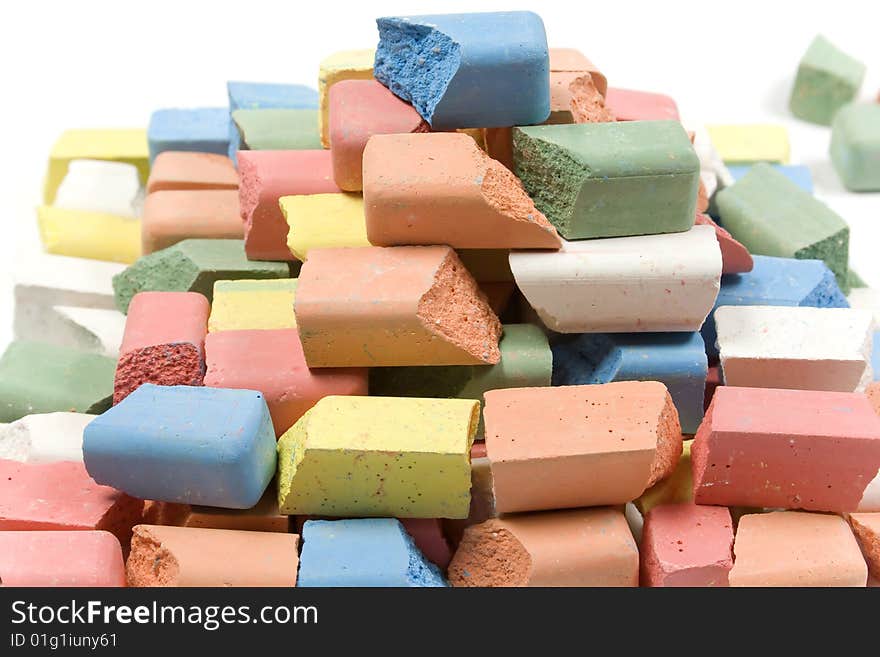 Group of crushed colored childrens chalk stacked in pyramid. Group of crushed colored childrens chalk stacked in pyramid