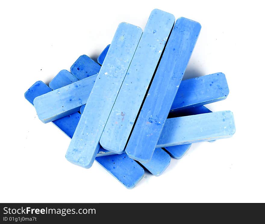 Stacked group blue chalk on white background. Stacked group blue chalk on white background