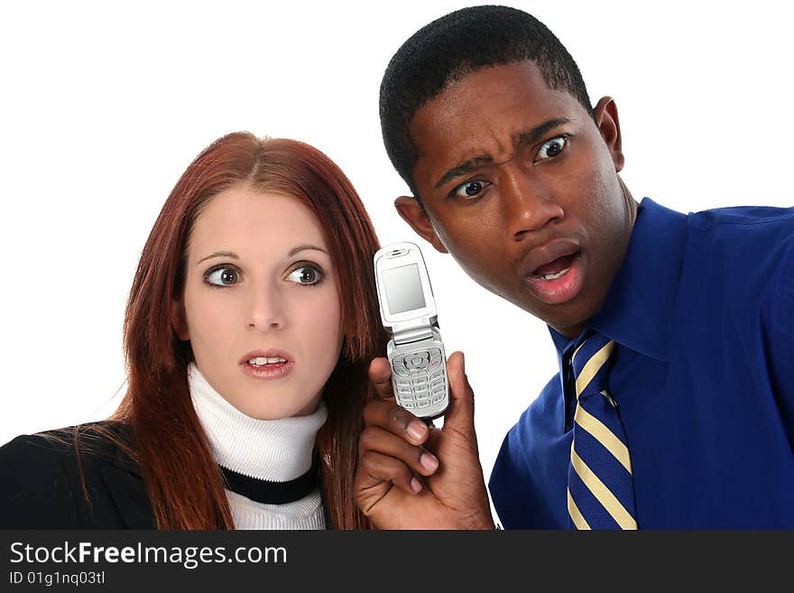 Attractive Interracial Couple Sharing Cellphone over white background.