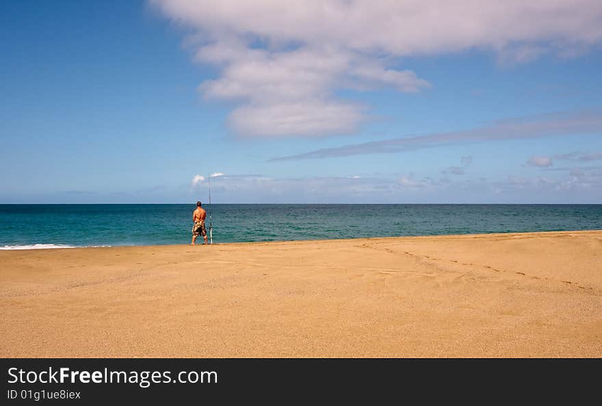 Sea Fisherman On An Empty Beach