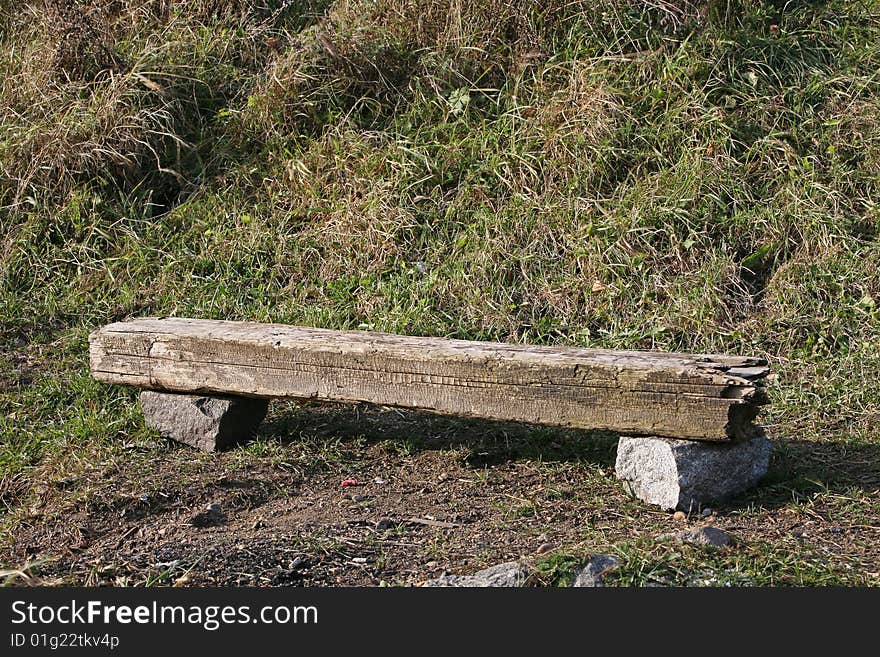 Bench made of make-shifts - an old cross tie and stones