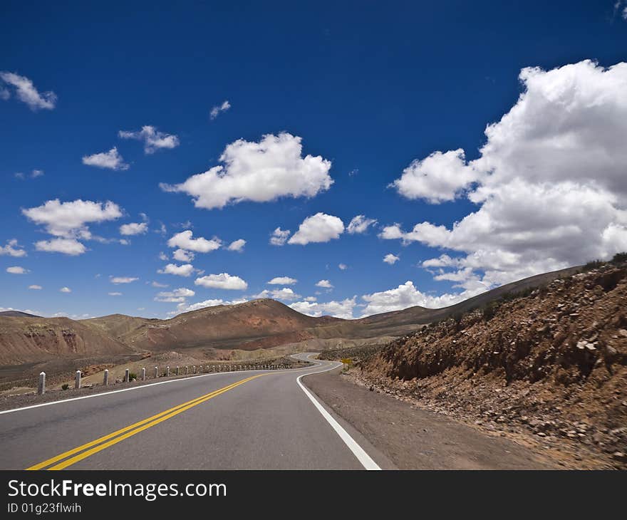 A winding road ahead. Small motion blur. A winding road ahead. Small motion blur.