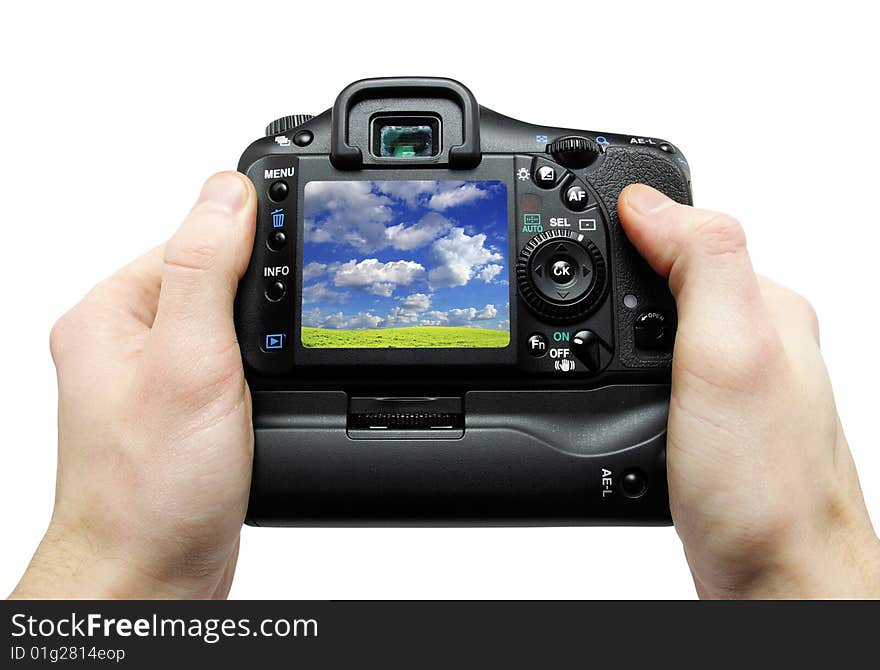 Black digital camera in hands