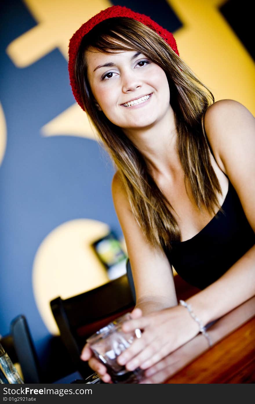 A beautiful young woman having lucnh in a cafe