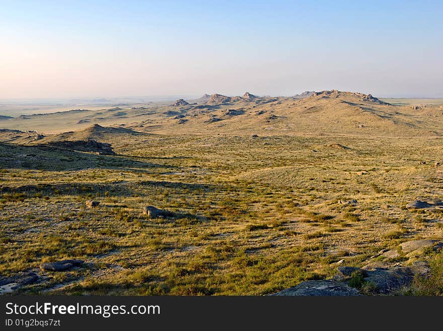 Hills with rocks under blue sky. Hills with rocks under blue sky