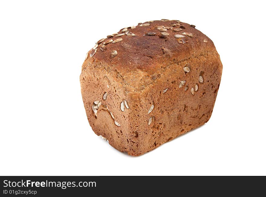 Loaf of bread full of seeds isolated on a white background. Loaf of bread full of seeds isolated on a white background.