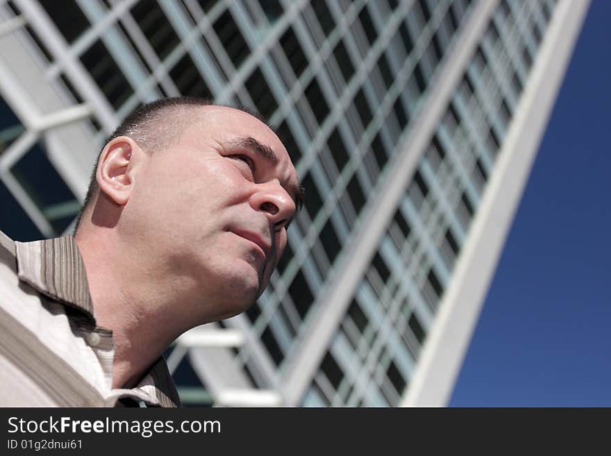 Portrait of man on a skyscraper background. Portrait of man on a skyscraper background