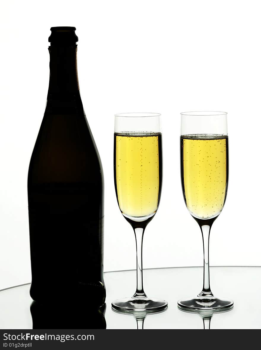 Two glasses of champagne on isolated white background. Two glasses of champagne on isolated white background