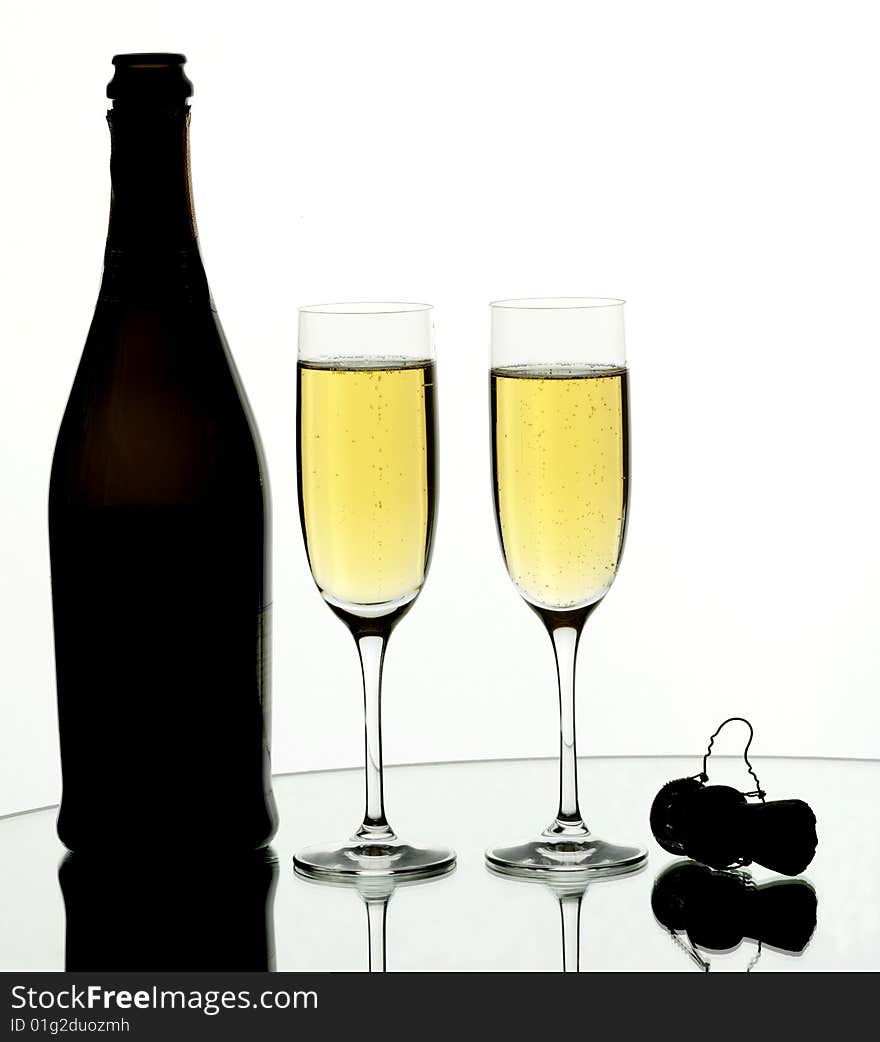 Two glasses of champagne on isolated white background