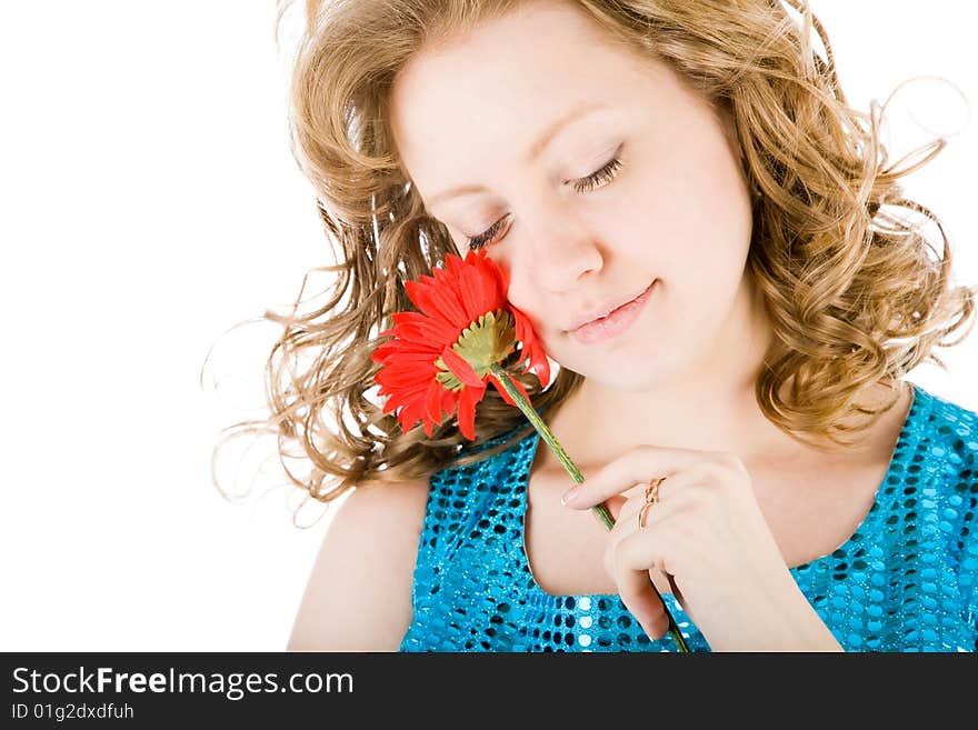 Young blond holding a red flower isolated