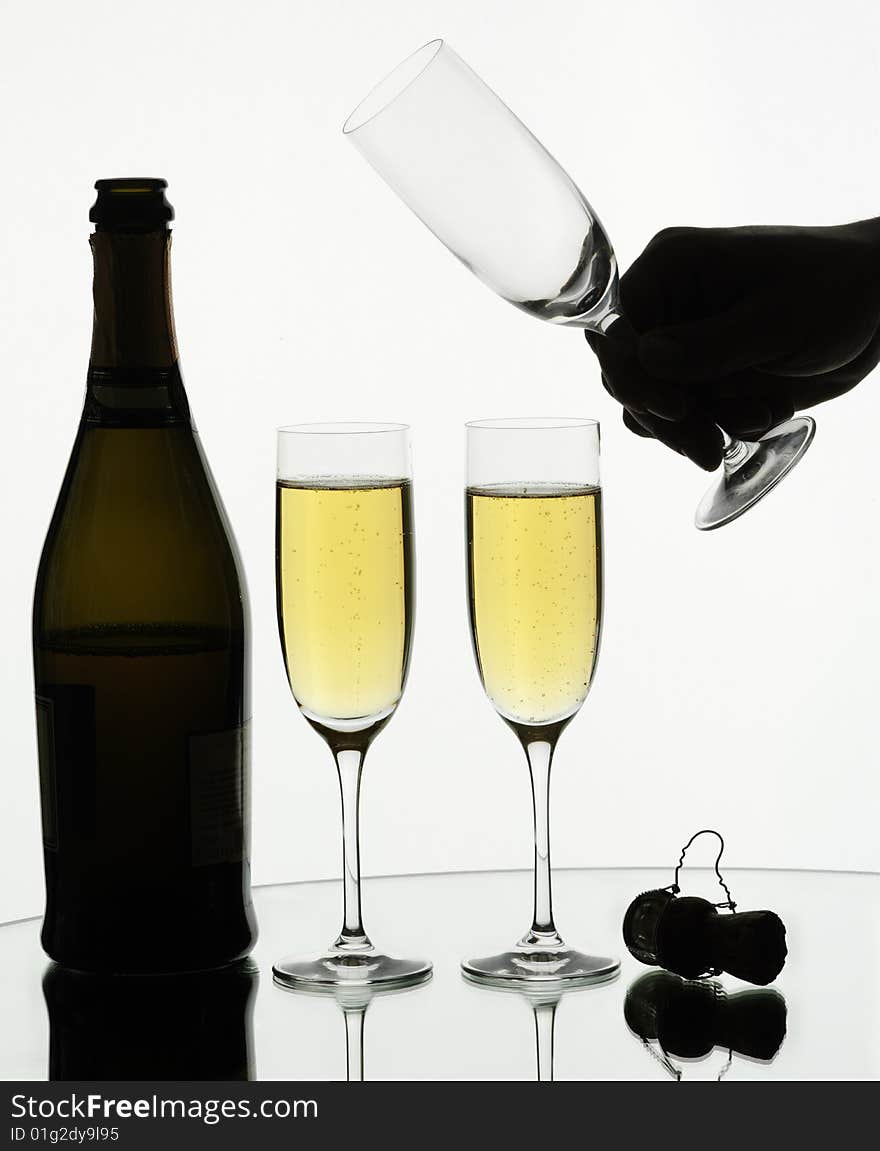 Two glasses of champagne on isolated white background