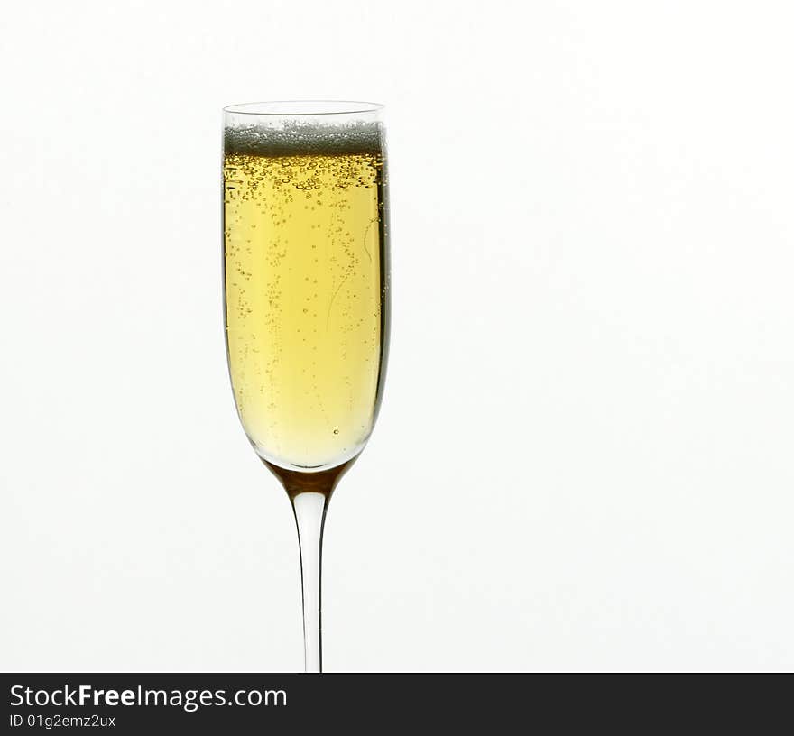 A champagne flute against a white background.