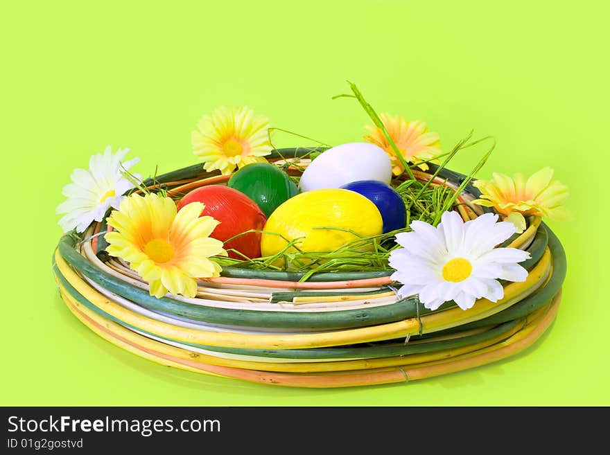 Easter eggs in the nest on white background