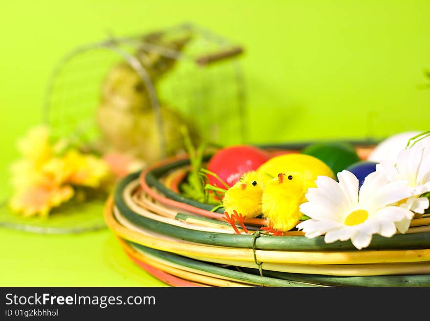 Easter decoration over the green background with shallow DOF