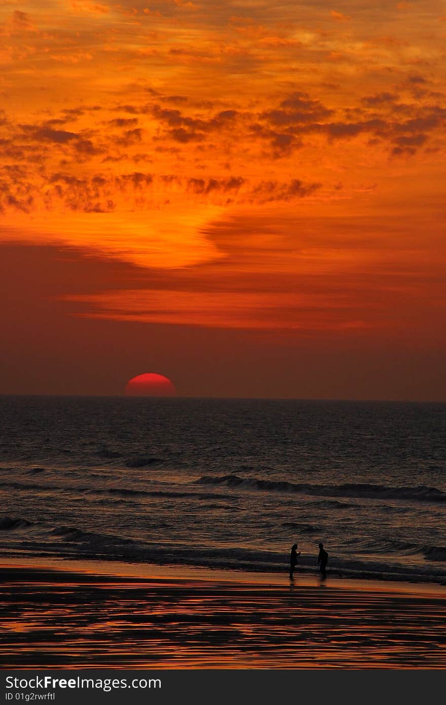 A beautiful sunset view with a couple