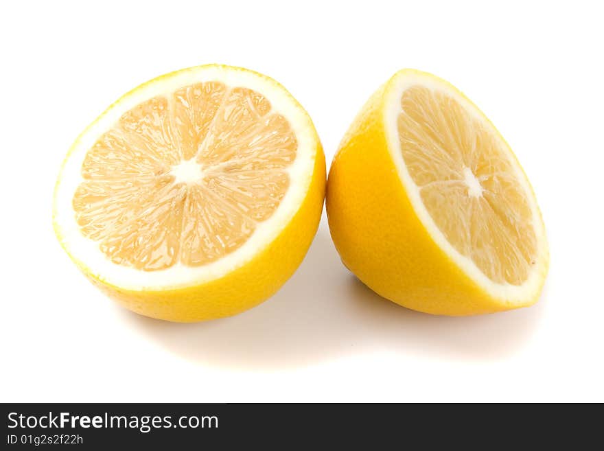 Fresh lemon halves on white background