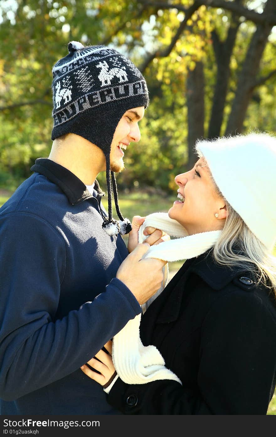 Two nice romantic young caucasian in urban style hugging in the park. Two nice romantic young caucasian in urban style hugging in the park