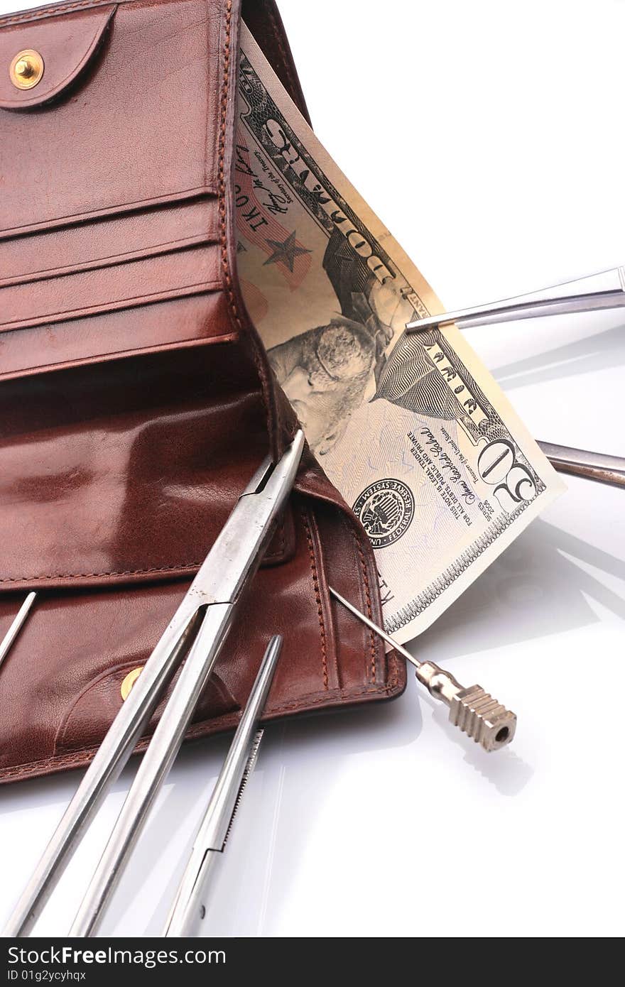 Surgical tools, purse and money. Surgical tools, purse and money