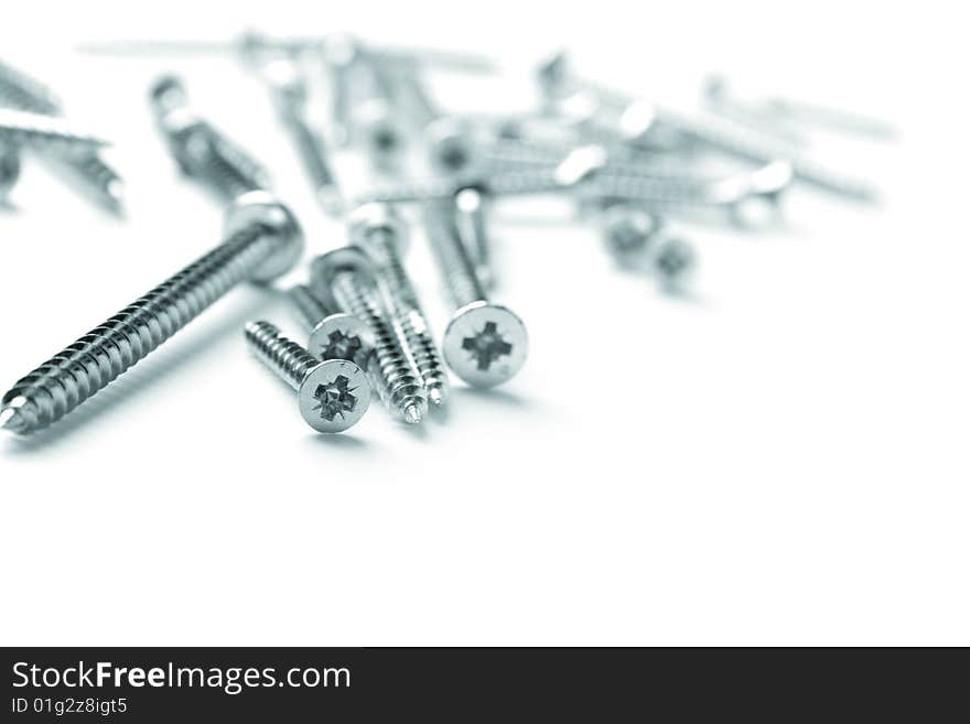 Metal screws closeup on white background