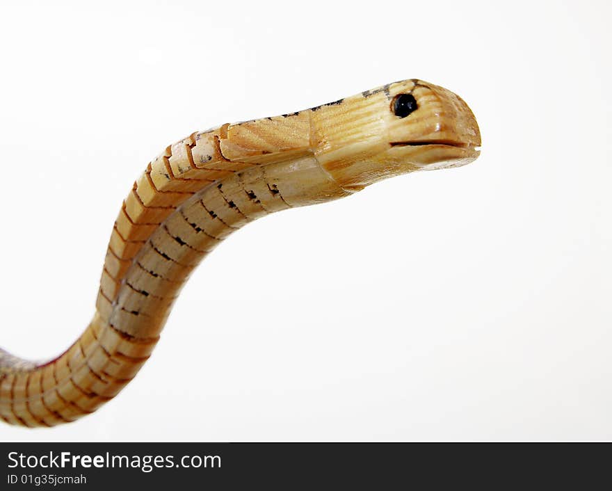 A wooden snake with a white background