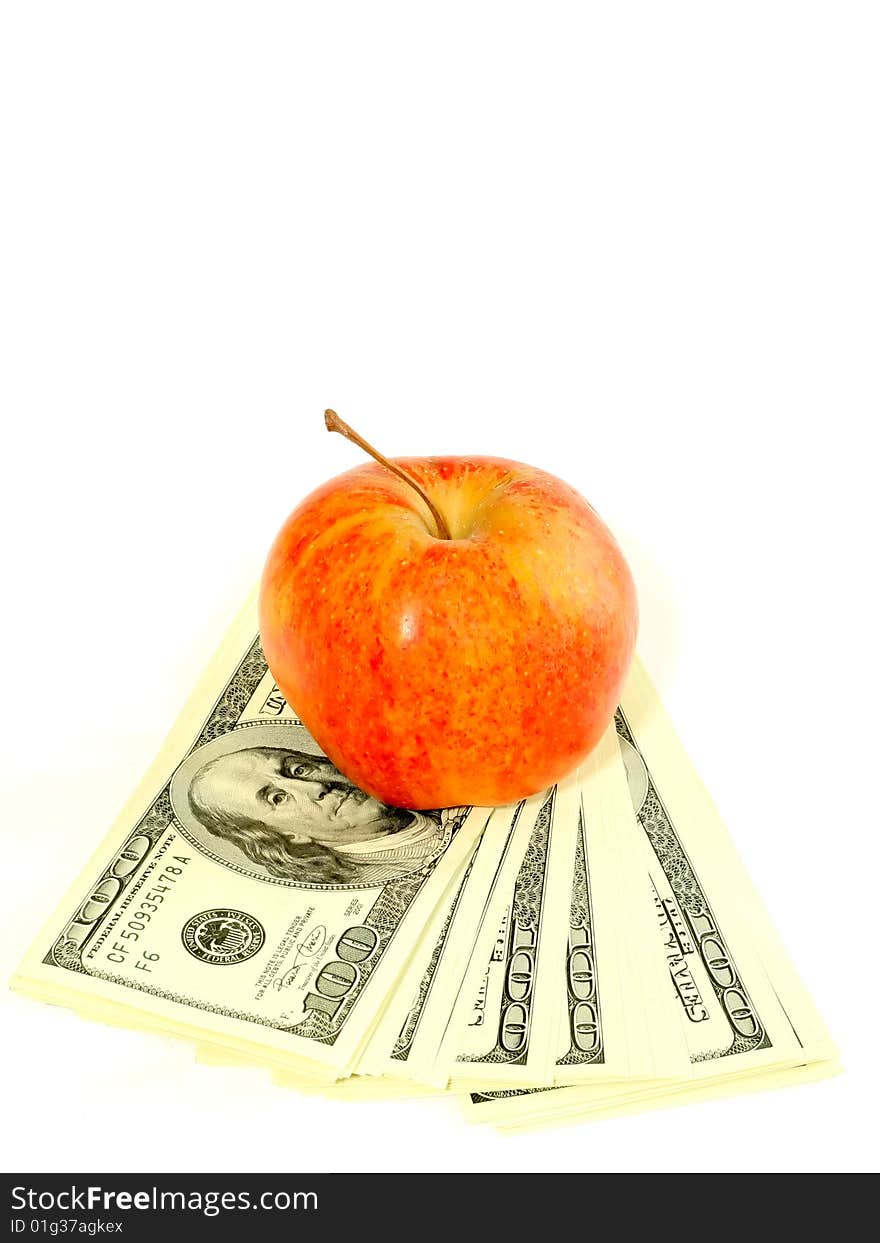 Banknotes of dollars and apple isolated on a whit