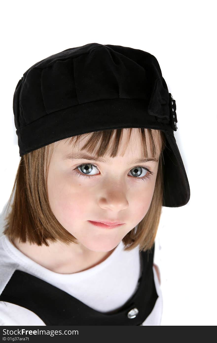 Adorable young girl in black hat turned sideways. Adorable young girl in black hat turned sideways