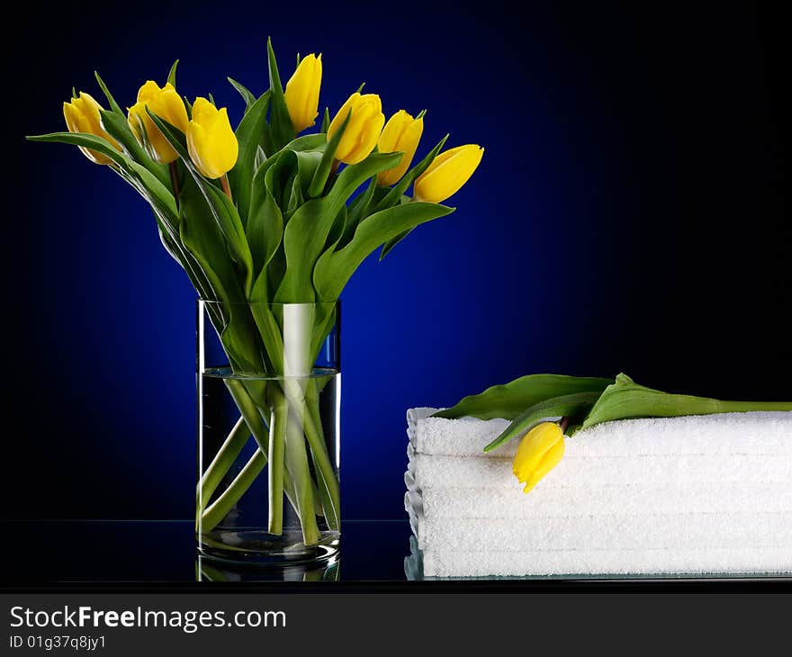 Towels Near Yellow Tulips