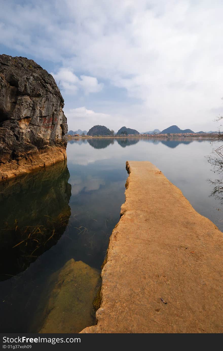 The brown color flagstone, extends to the blue color lake center