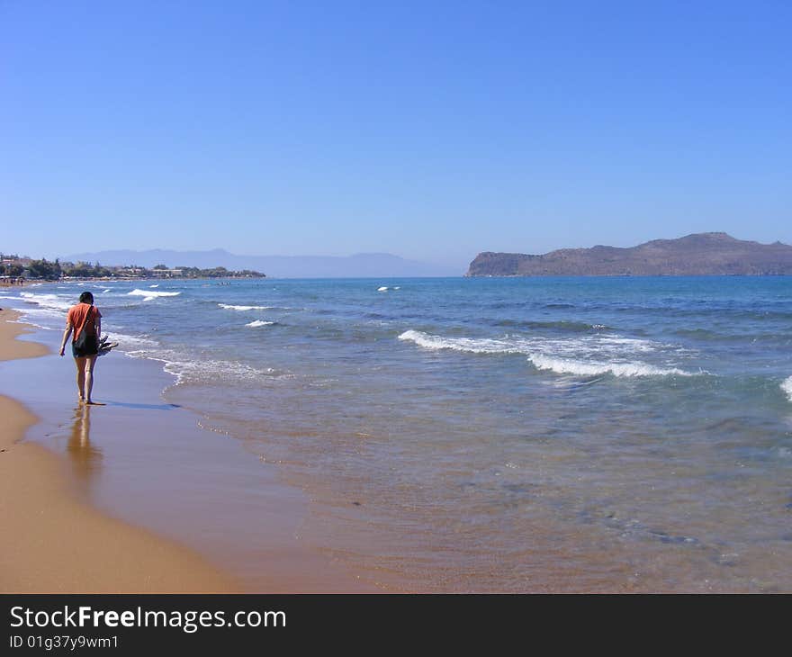 Woman walking alone on the beach. Woman walking alone on the beach