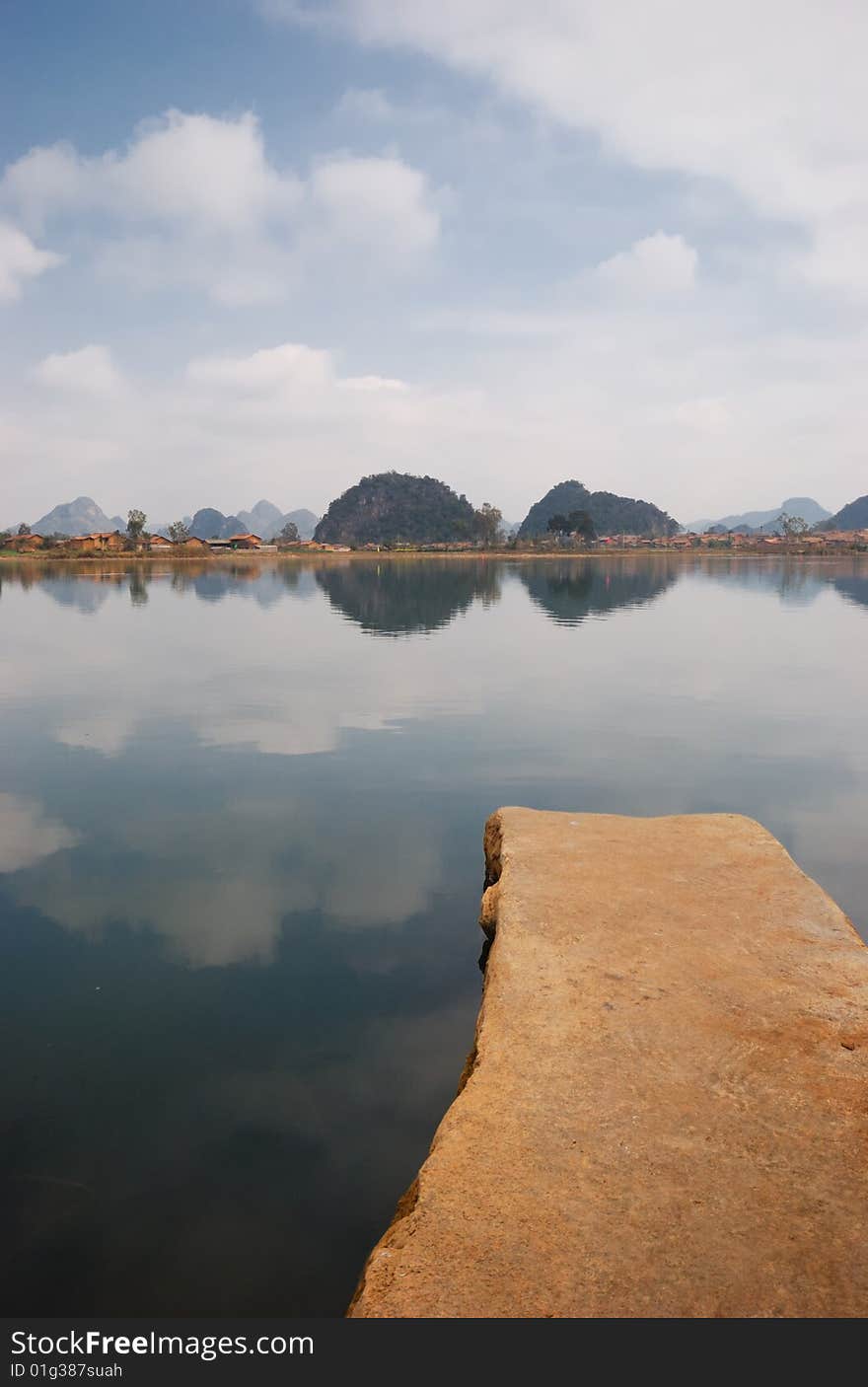 The brown color flagstone, extends to the blue color lake center