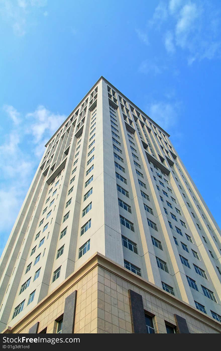 Modern office building against blue sky