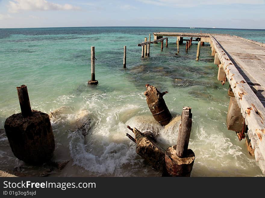 Caribbean blue ocean beach and pier scene. Caribbean blue ocean beach and pier scene