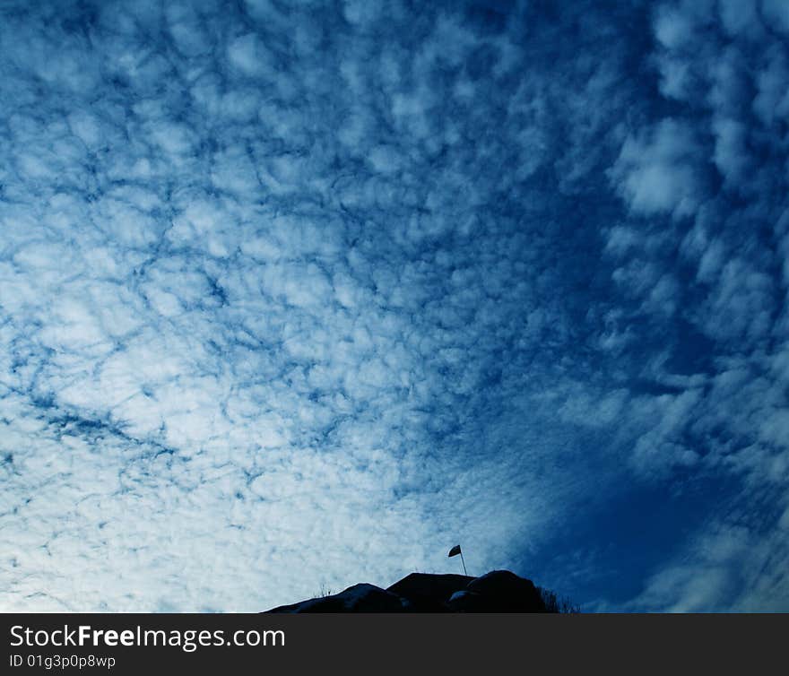 Lonely Flag Against Blue Sky