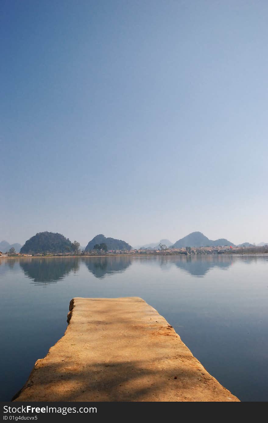 The brown color flagstone, extends to the blue color lake center