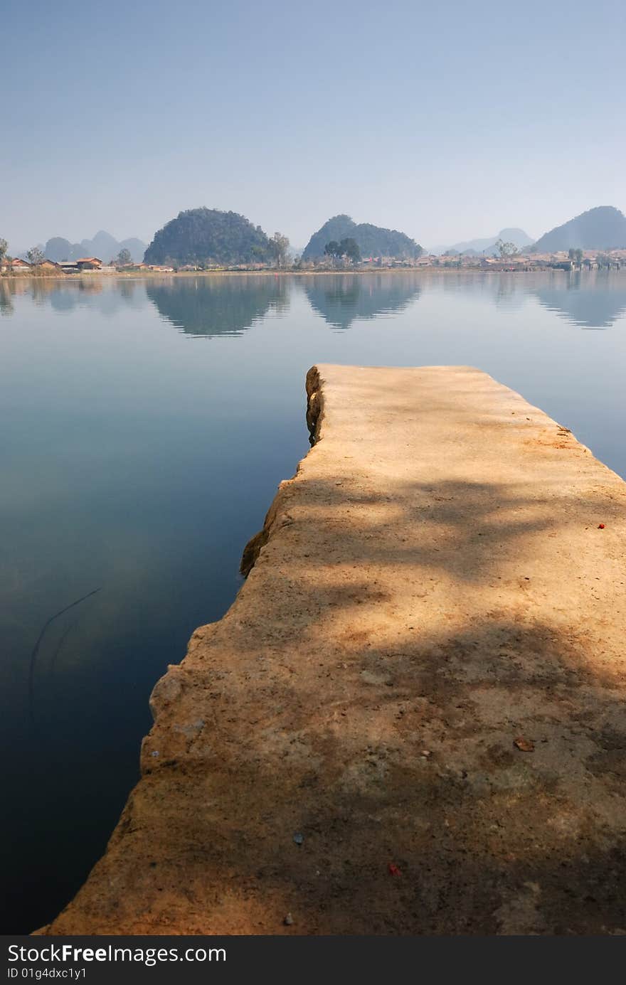 The brown color flagstone, extends to the blue color lake center