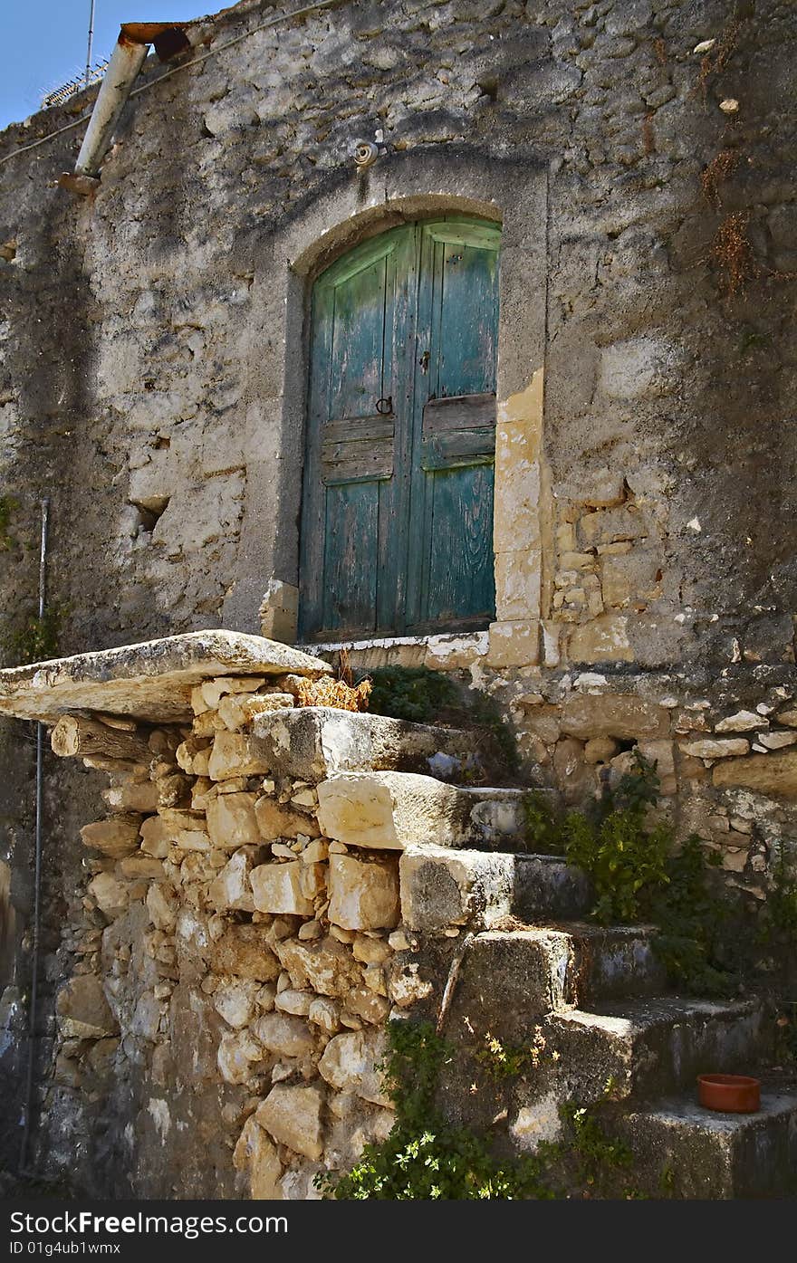 Old fashioned door in traditional cretan village. Old fashioned door in traditional cretan village