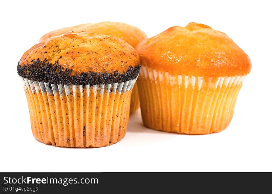 Three tasty muffins with poppies isolated on white background. Three tasty muffins with poppies isolated on white background