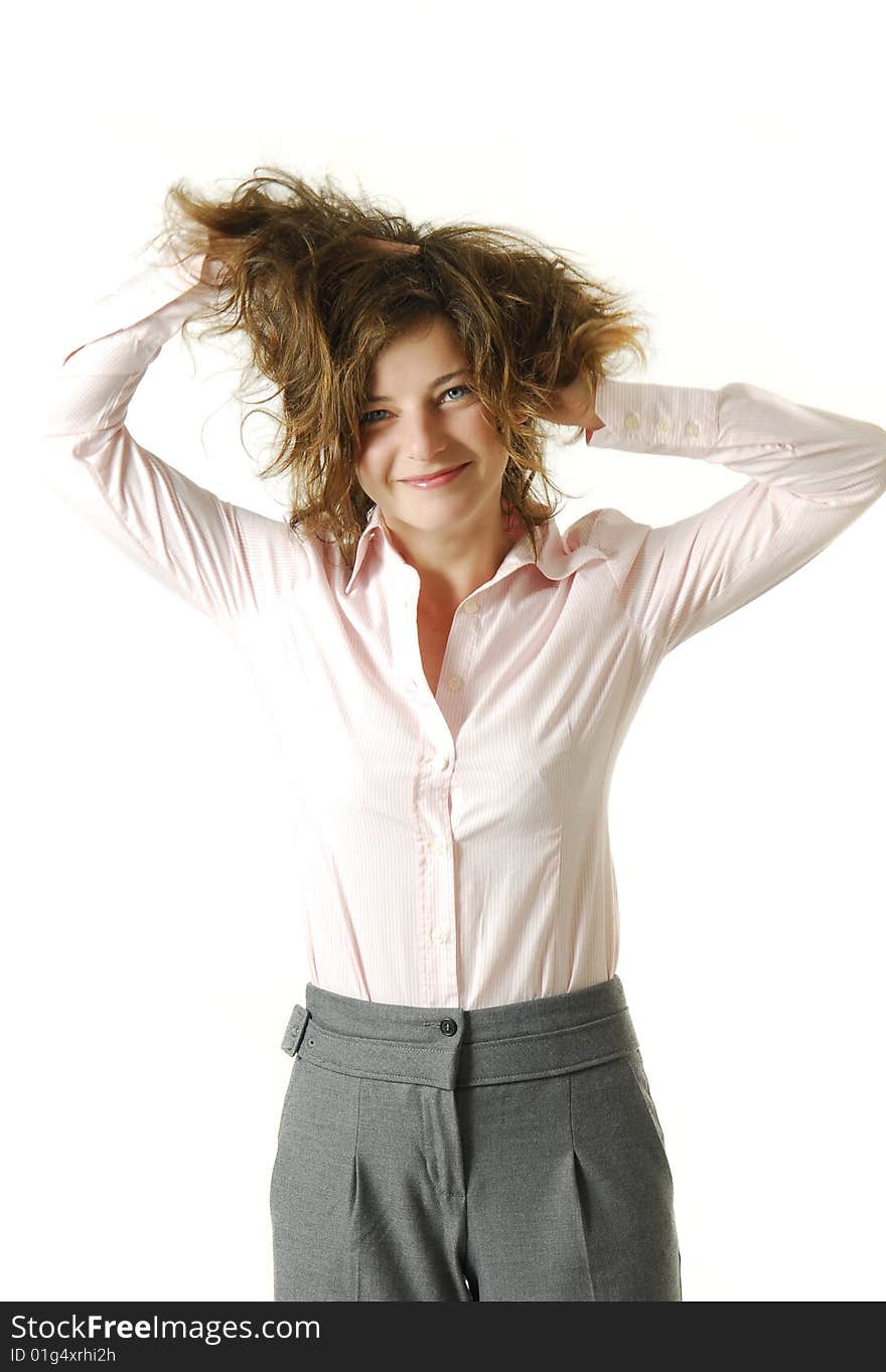 Young businesswoman smiling and messing up her hair. Young businesswoman smiling and messing up her hair