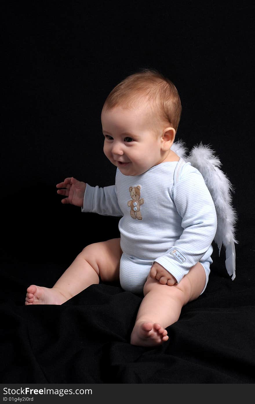 Little Angel over black background