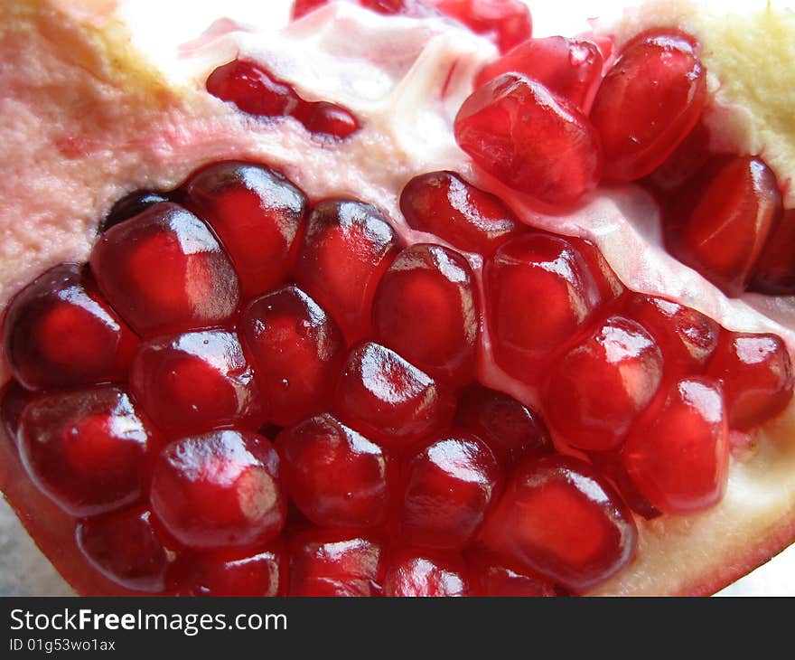 Red juicy pulp of pomegranate