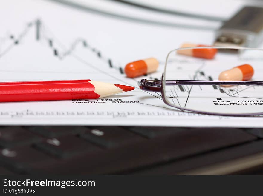 Analyzing a economical chart of bussines with red pen