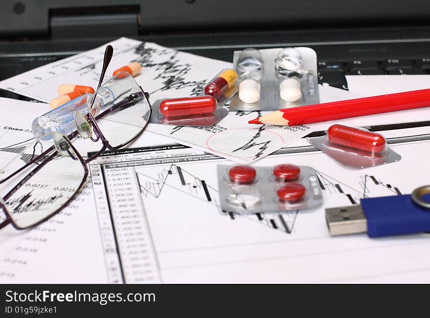 Analyzing a economical chart of bussines with red pen