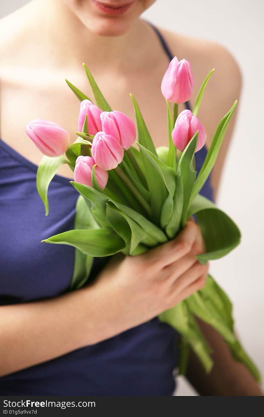 Beautiful hands holding tulips. Soft-focused. Beautiful hands holding tulips. Soft-focused.