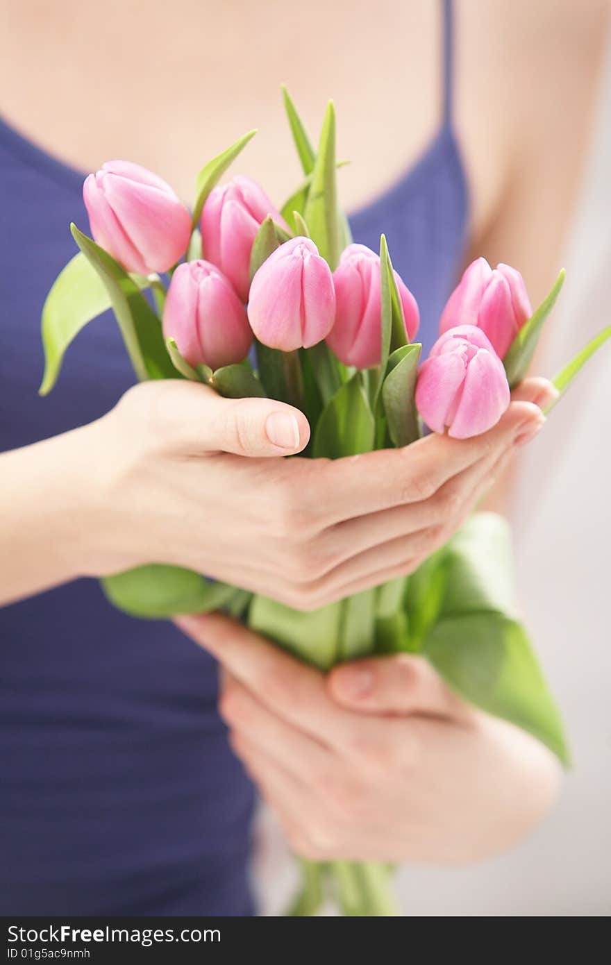 Beautiful hands holding tulips. Soft-focused. Beautiful hands holding tulips. Soft-focused.