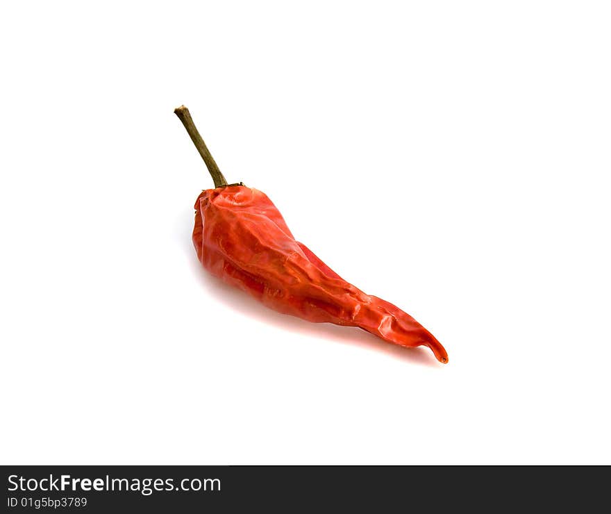 Red hot pepper close up, isolated over the white background