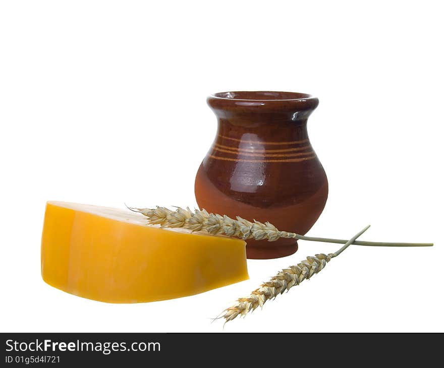 Wheat, jug and  cheese isolated on white. Wheat, jug and  cheese isolated on white.